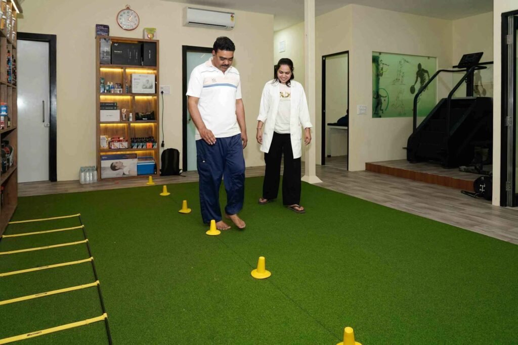 Physiotherapist helping a patient with balance training and gait rehabilitation in Indore clinic